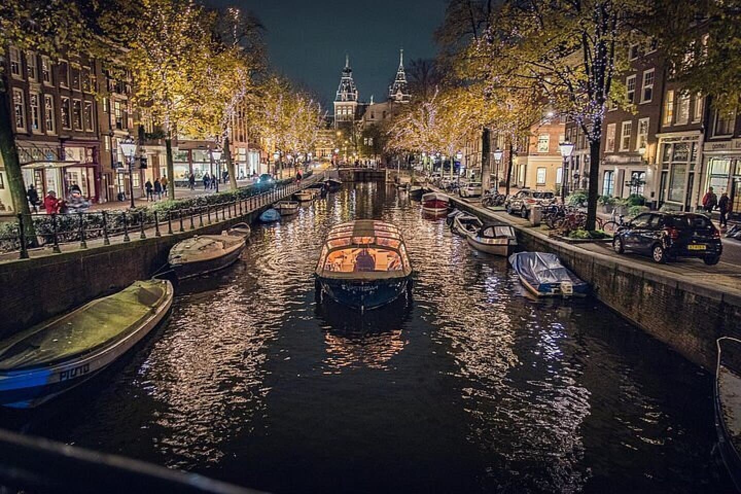 Evening Canal Cruise with a Green Boat, image 1 of 1